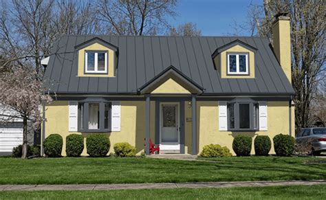 yellow house with gray metal roof|exterior house paint brown roof.